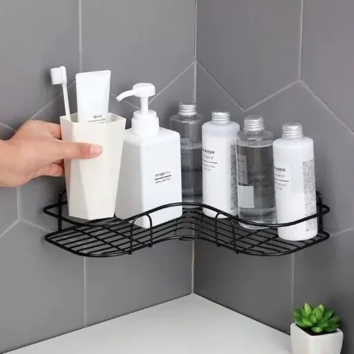 Schwarze Duschablage als Eckregal in der Dusche